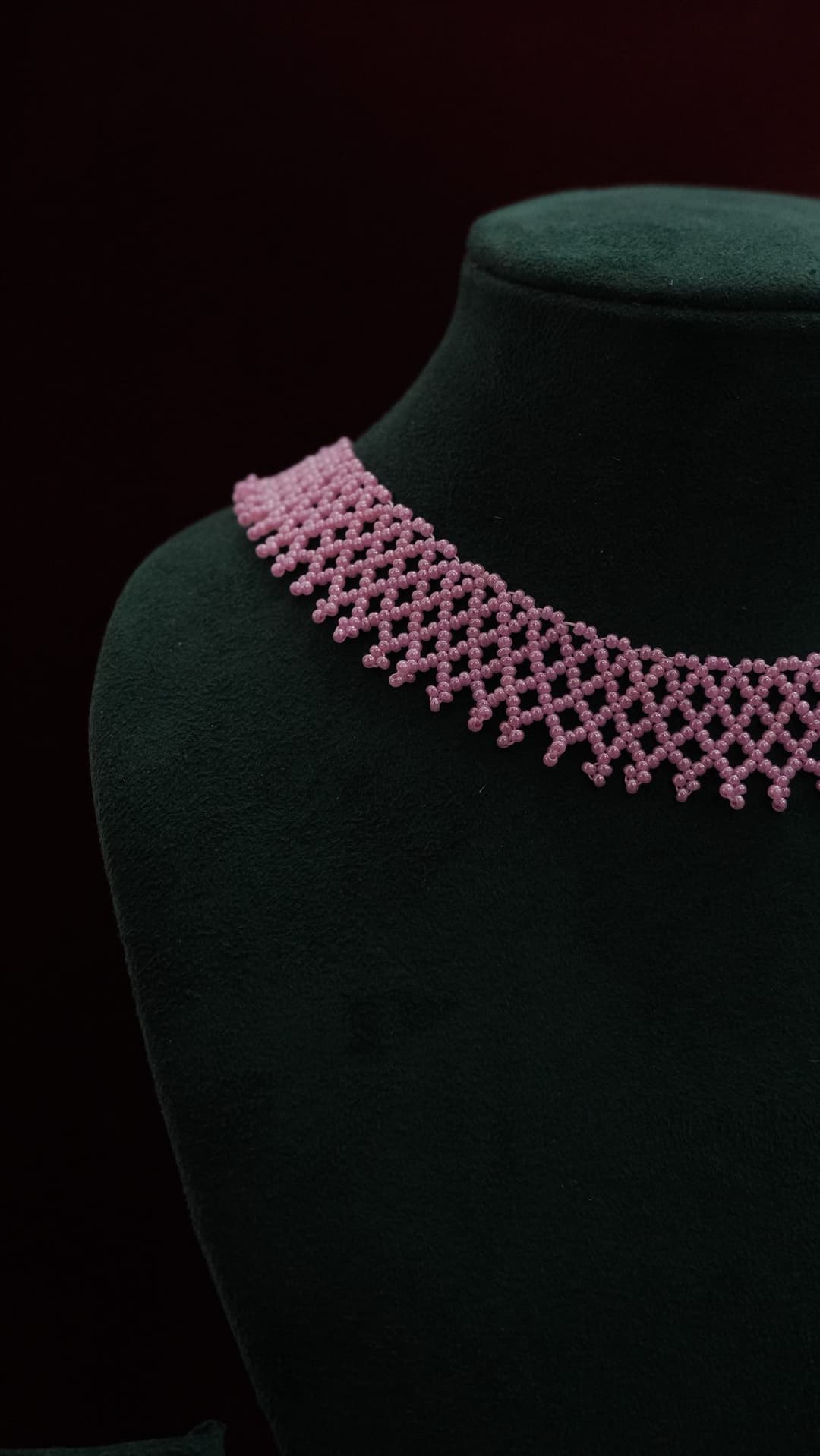 A wide woven net collar in blush